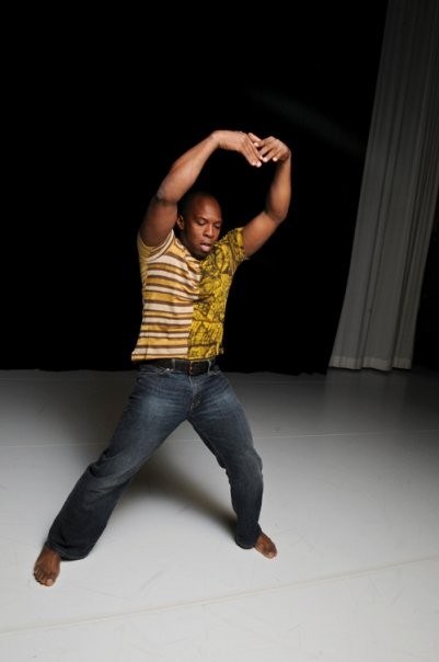 Boris Willis with both arms framing his head in a wide stance